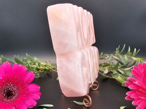 Side view of rose quartz Horse Girl carving showing its thickness